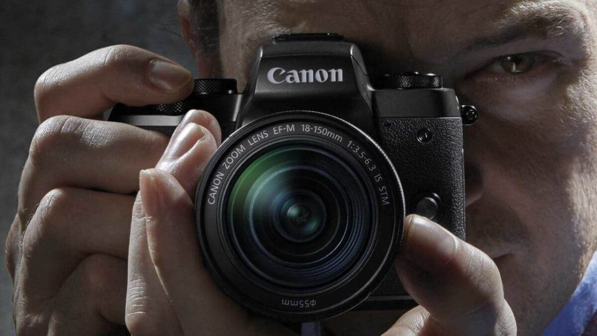 Canon EOS M5 guy looking throu
